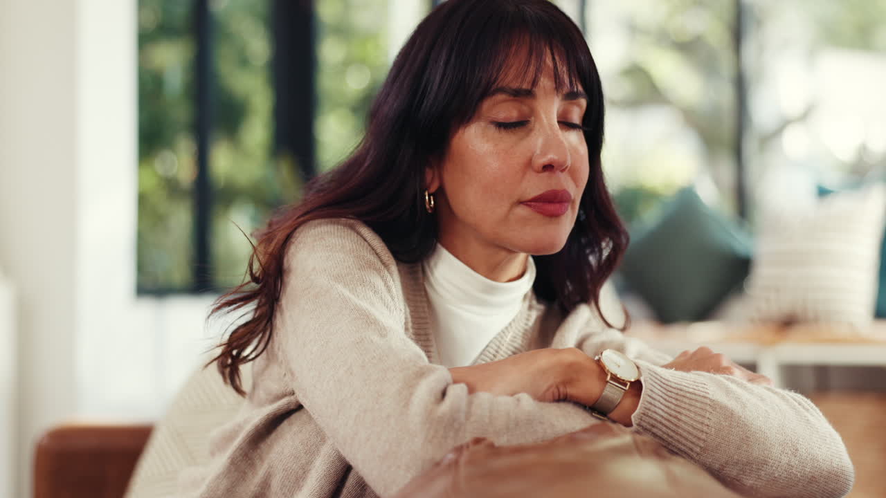 Pensive woman sitting indoors