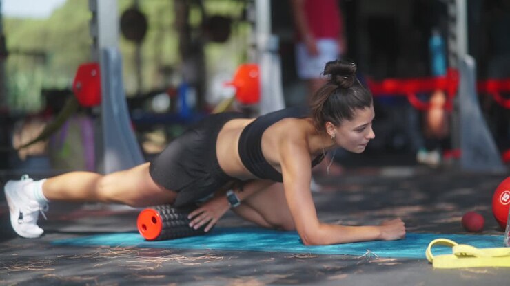 Woman Performing Hip Flexor Stretch Outdoors