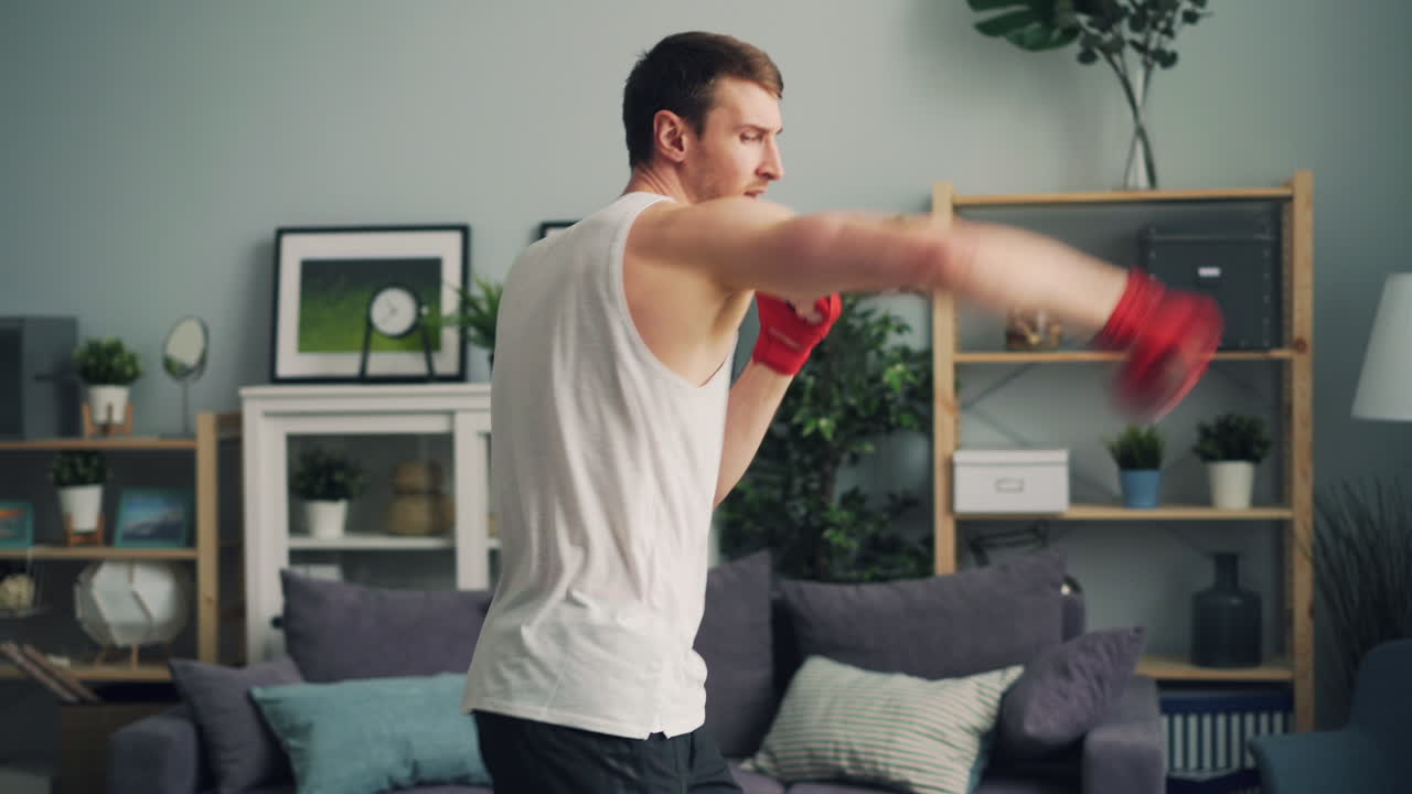 Man practicing boxing at home