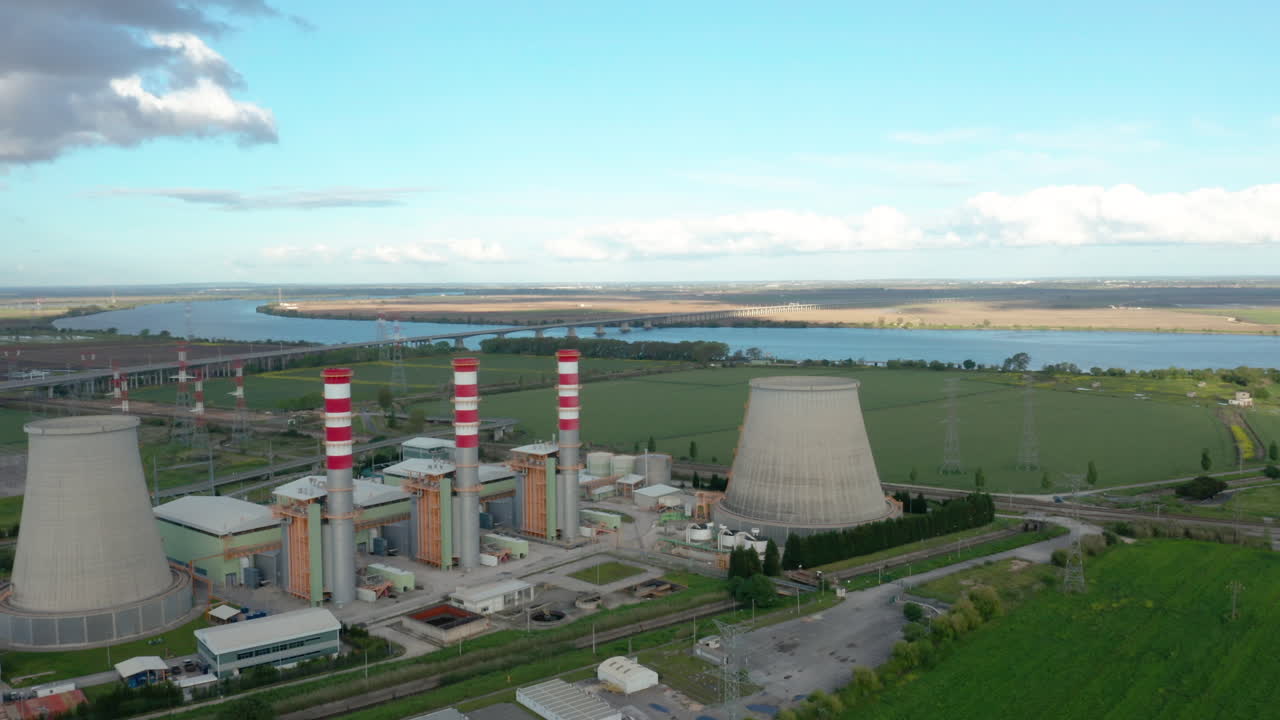 Aerial truck shot power station river side, coal-burning power plant - Carregado
