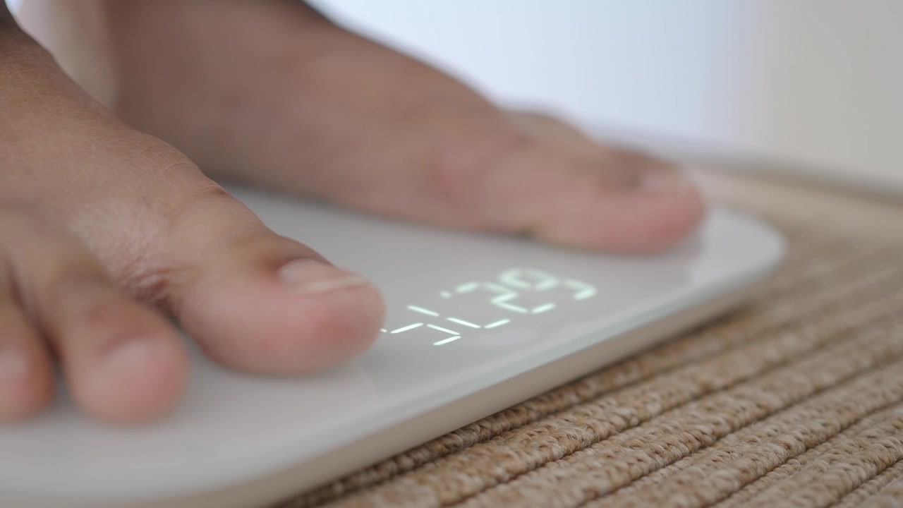 Person Standing on Digital Bathroom Scale