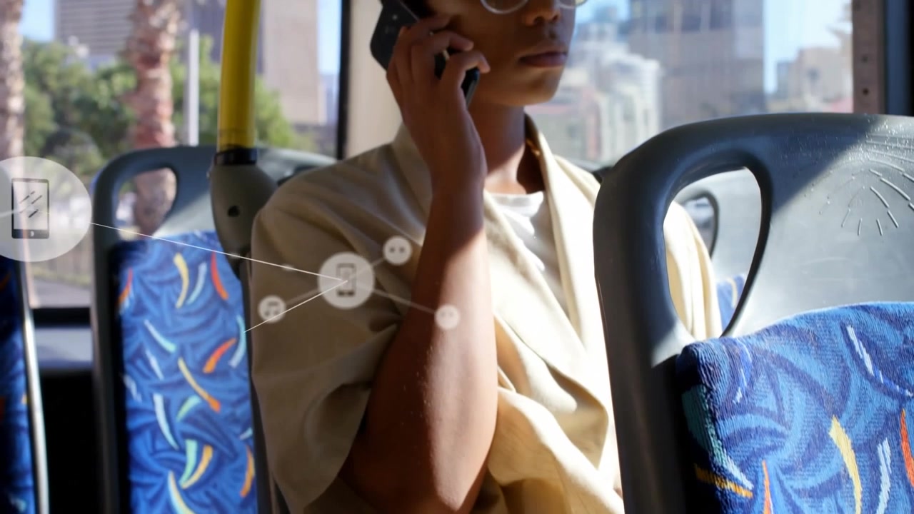 Animation of network of connections over african american woman talking on smartphone in bus