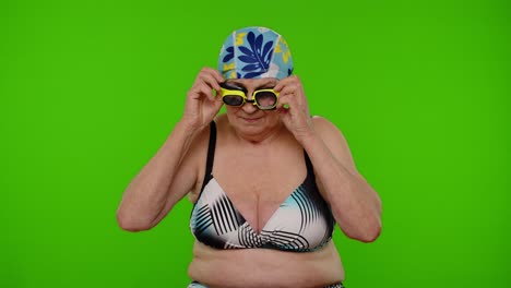 senior woman swimming in a pool