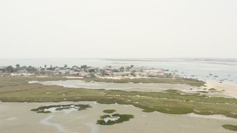 beach houses and bars on armona island in algarve, portugal