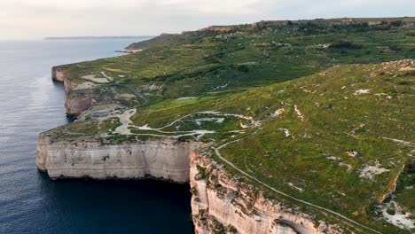 capture the tranquil isolation of miġra l-ferħa, where dramatic rock formations and green valleys define one of malta’s most pristine coastal stretches.