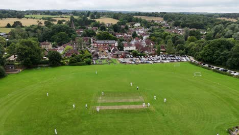 cricket match shere surrey uk quaint english village ascending drone,aerial