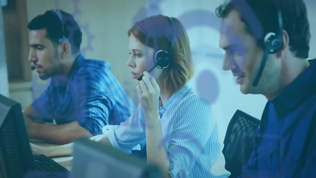 Animation of purple social icons floating over group of call centre workers