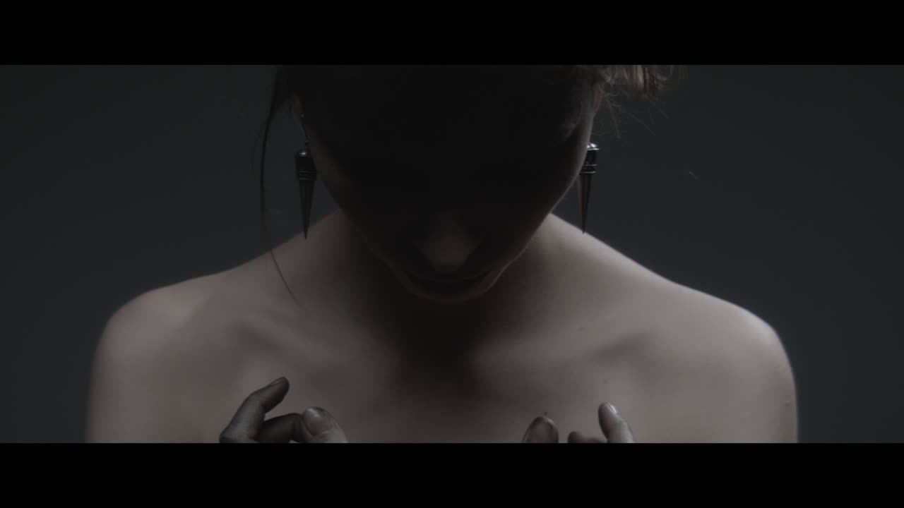 A woman dressed as mother nature rise her head