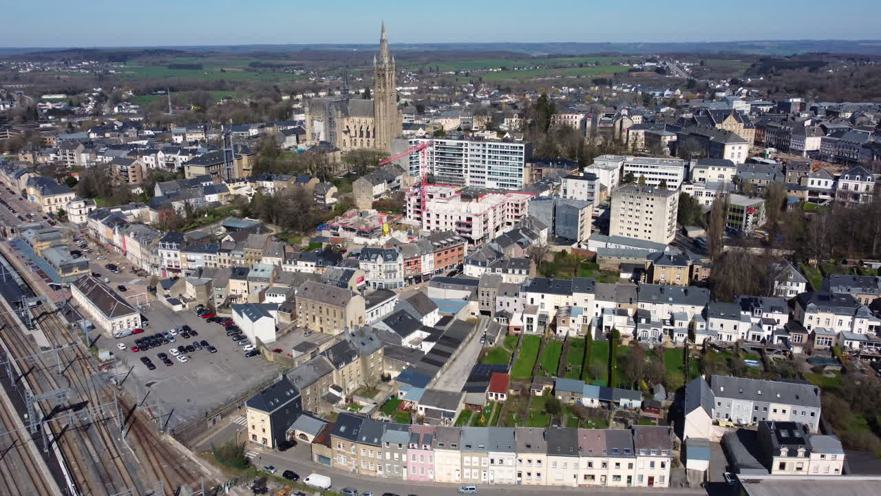 Aerial view of a European city with construction sites and historical buildings