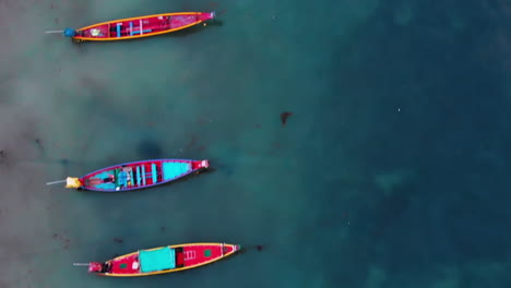 aerial shot of koh tao island, super sunset at sairee beach with many boats floating, zenital view thailand