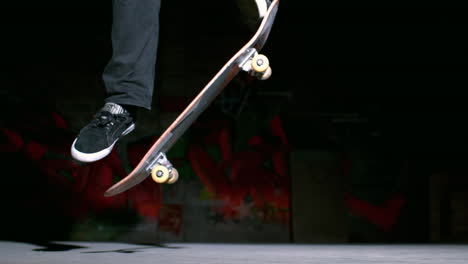 skater doing ollie trick on concrete