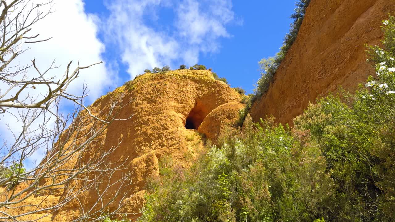 Wonderful Golden Mountains Surrounded By Vegetation With A Small Opening