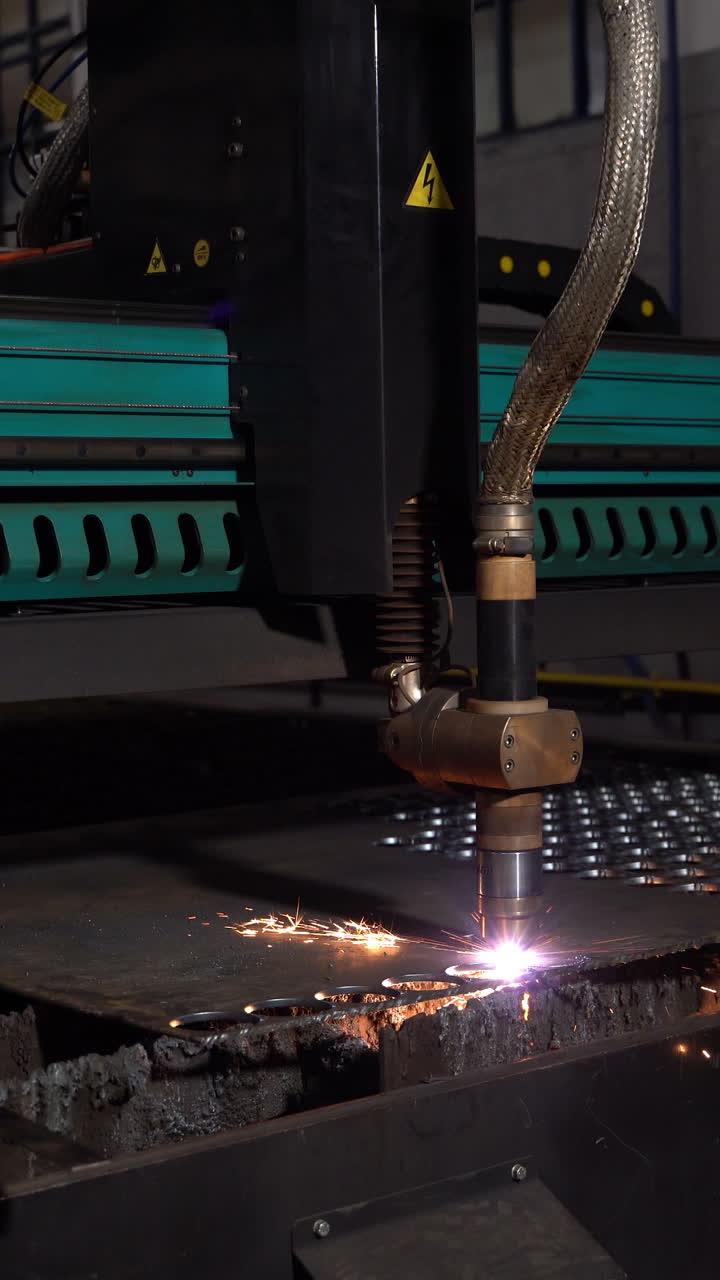 Laser cutter cuts metal parts. Industrial machine CNC. Plasma laser processing manufacture technology. Automatic work for ironwork. Vertical video