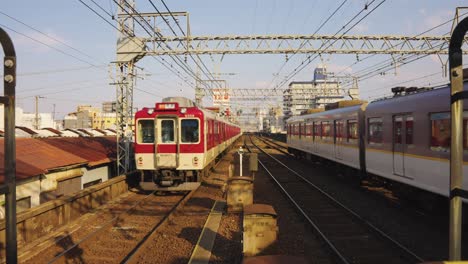 Trains-Departing-Tsuruhashi-Station-in-Osaka,-Japan-on-a-Sunny-Day