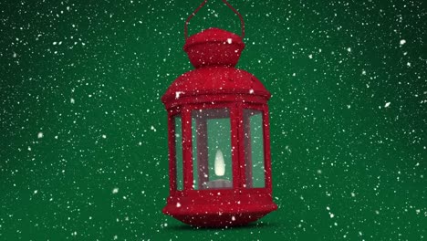 animación de nieve cayendo sobre linterna roja sobre fondo verde