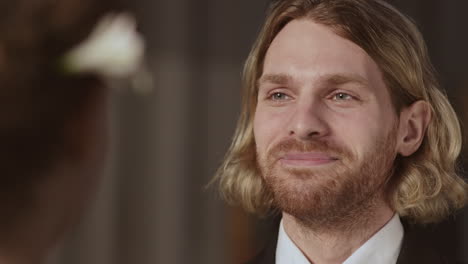 handsome caucasian groom pronouncing wedding vow