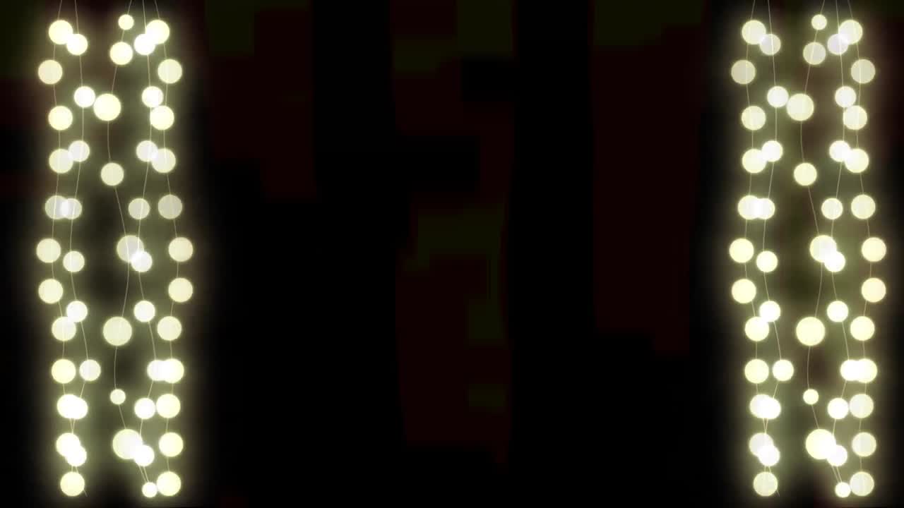 Digital animation of decorative fairy lights hanging against black background