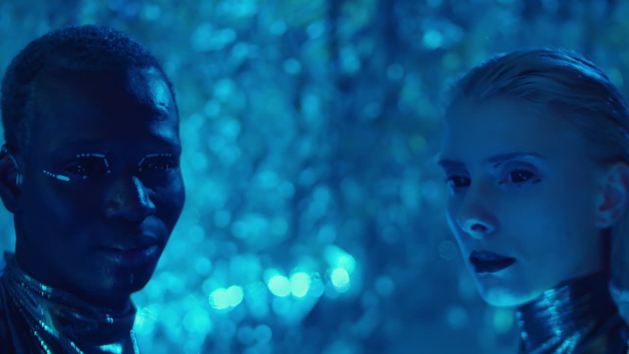 Futuristic Man and Woman in Blue Laser Light