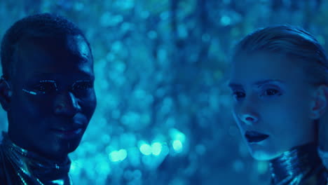 futuristic man and woman in blue laser light