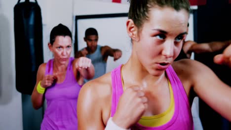 Boxers-practicing-in-boxing-ring