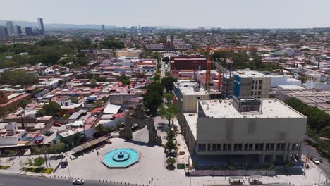 zapopan metro train station, downtown cityscape, guadalajara, mexico, drone shot