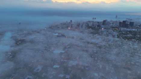 misty morning in santo domingo: wide-angle aerial views of the dominican capital with winter fog and blurred cityscape