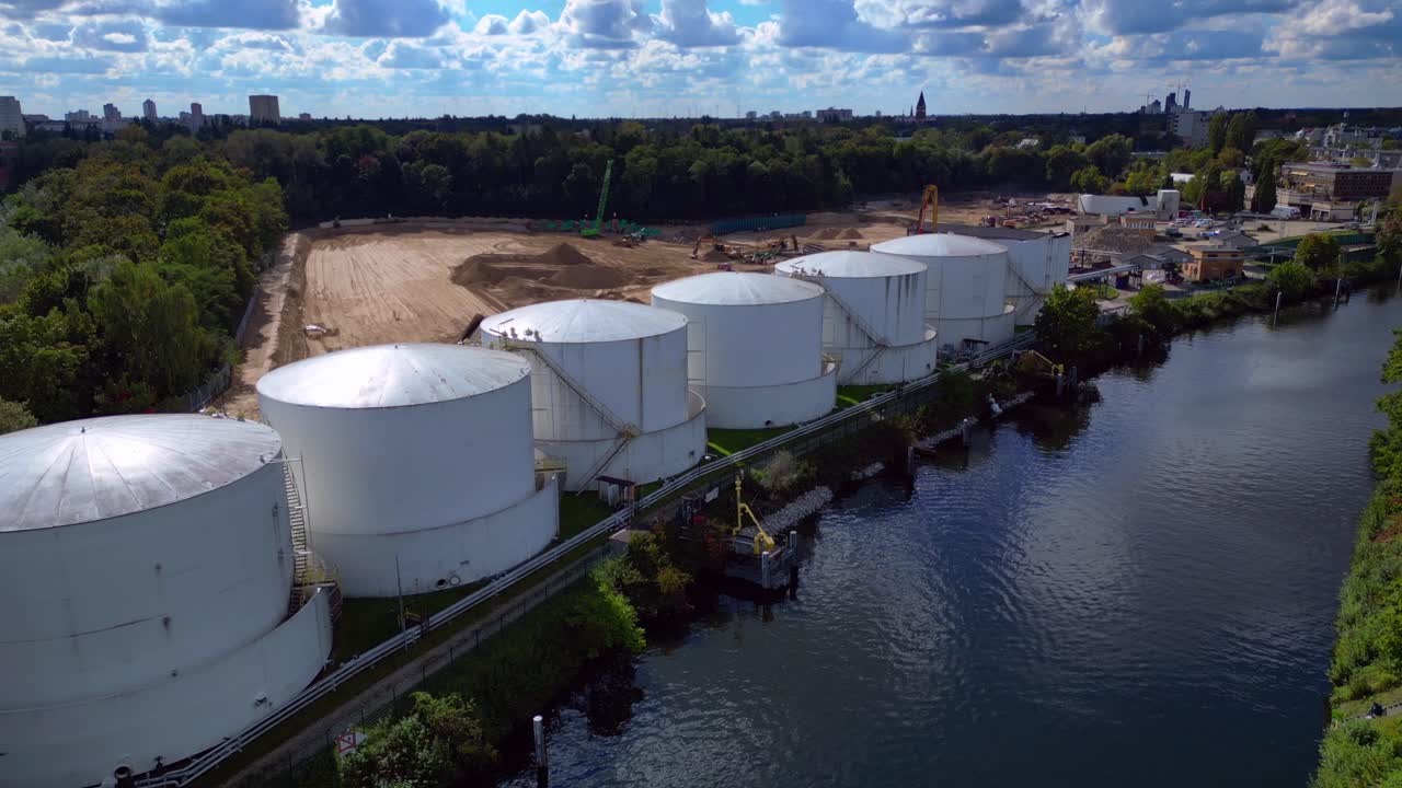 Decommissioning of Storage depot for petroleum products storage silos and containers. Industrial storage tanks holding oil and gas products. Fantastic aerial view flight panorama overview drone