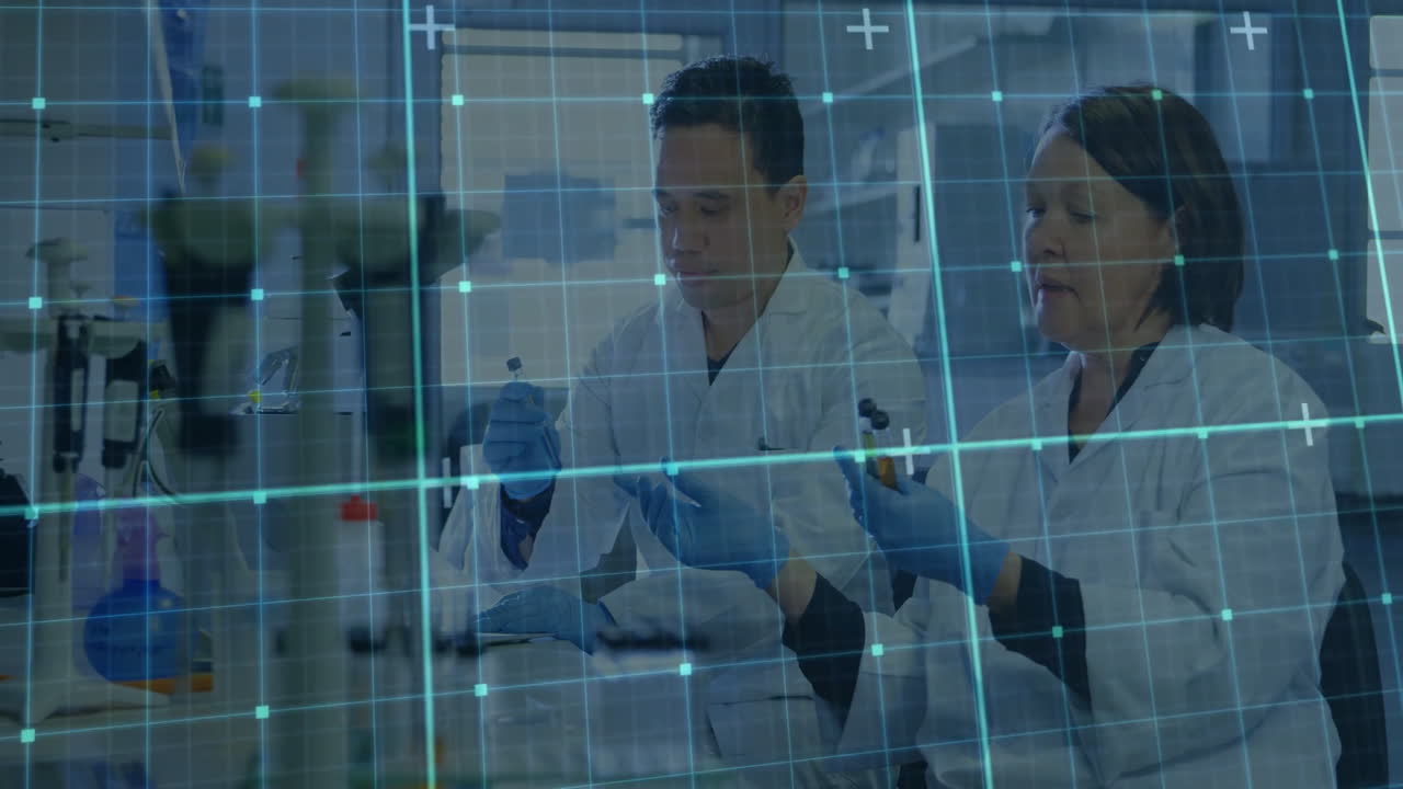 In lab, scientists working with digital animation overlay on data in laboratory
