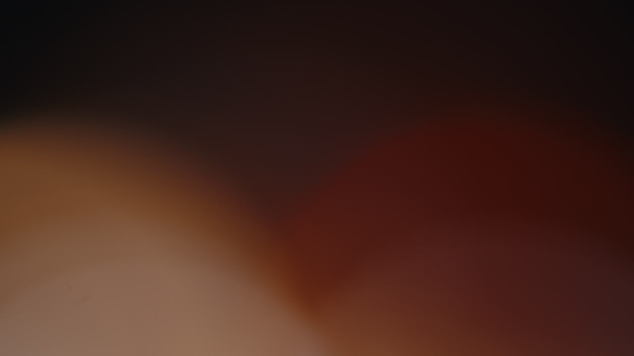 Multicolored light leaks 4k footage on black background stylizing video transitions bokeh effect
