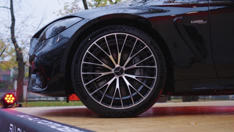 close-up of a black mercedes-amg with michelin tires