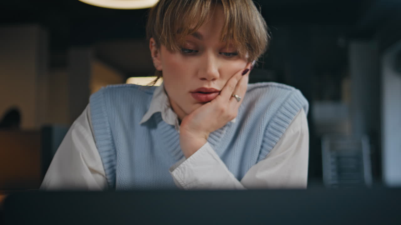 Businesswoman face looking laptop cabinet closeup. Busy woman staring computer