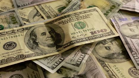 one hundred dollar banknotes. background of one hundred dollar bills