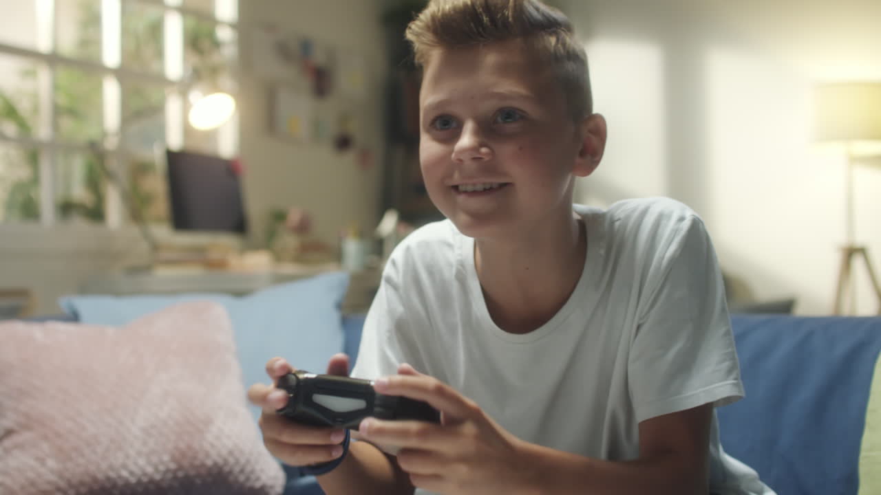 Young Boy Playing Video Games at Home