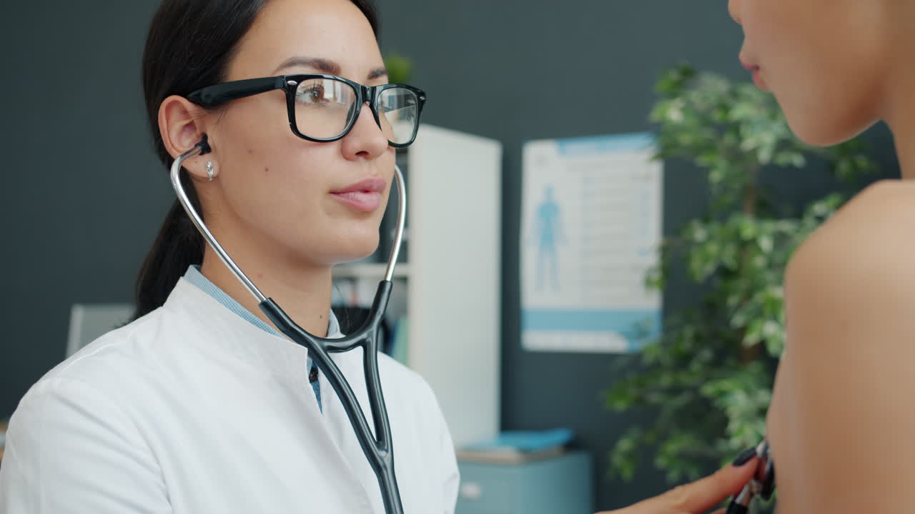 Doctor Examining Patient with Stethoscope