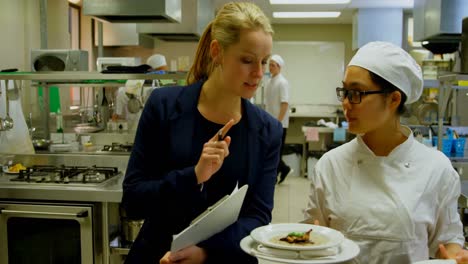 female manager and female chefs interacting with each other 4k