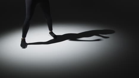 Close-Up-Studio-Shot-Of-Woman-Shadow-Boxing-In-Gym