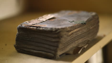 a very old book with a broken lock