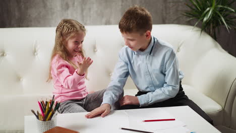 happy little children play hand clapping while having break