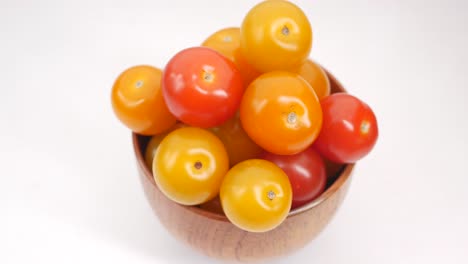 colorful cherry tomatoes in a wooden bowl