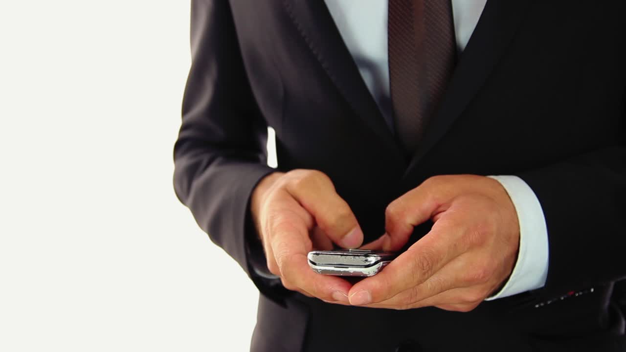 Businessman Using Mobile Phone For Text Messaging