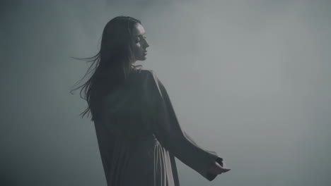 elegant woman in ethereal fog