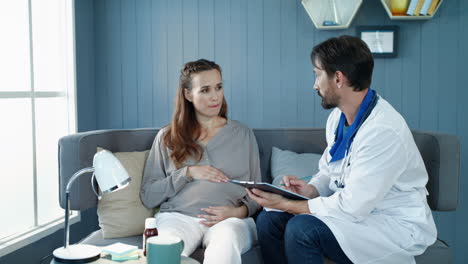 closeup pregnant woman listening doctor recommendations in prenatal cabinet.