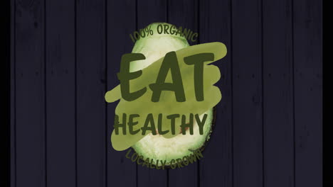 100% organic eat healthy locally grown text animation over dark wooden background