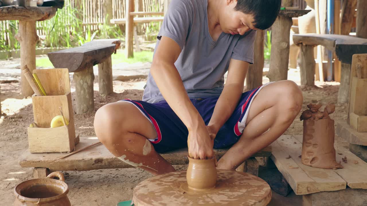 Asian Man Making A Clay Pot On Pottery Wheel, Video In 4K