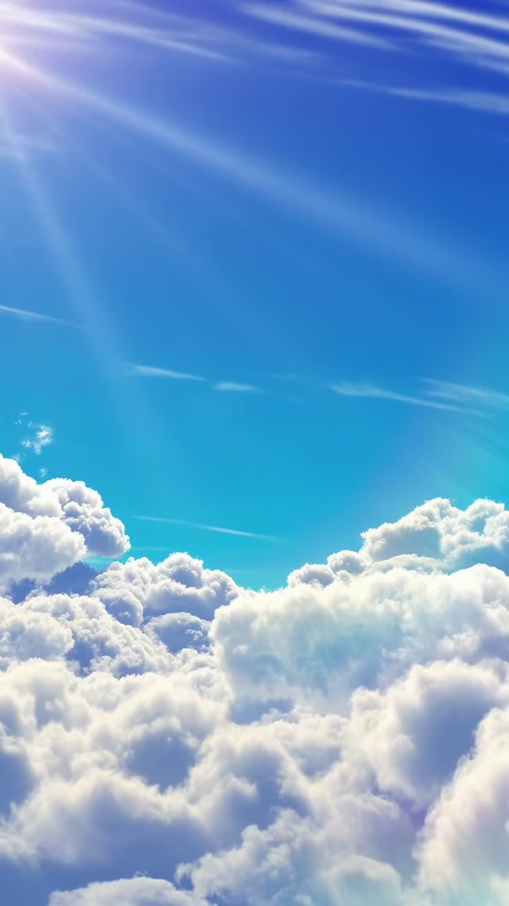 Vista video aerea di nuvole soffici e cielo blu, con la luce del sole che filtra dall'alto.