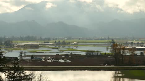 establishing shot devastating floods at abbotsford farmland landscape, british columbia