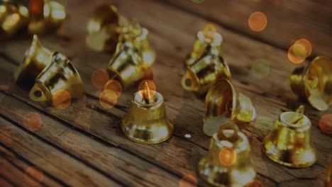 animación de campanas de oro de navidad en un fondo de madera rústica