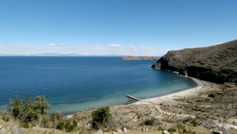 experience the serene beauty of las gemelas beach on isla del sol, copacabana, bolivia. showcases the crystal-clear waters and stunning panoramic views of lake titicaca