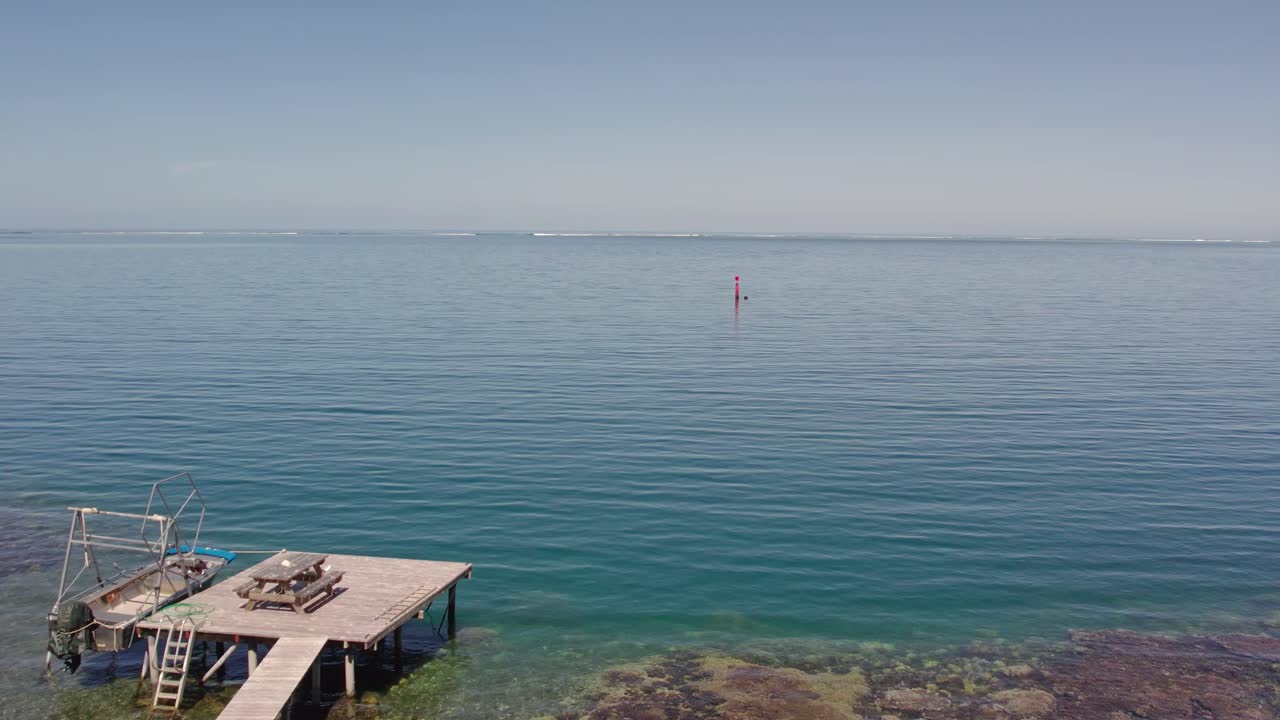 Falling Aerial Footage of a Beautiful Dock in Tropical Tahiti