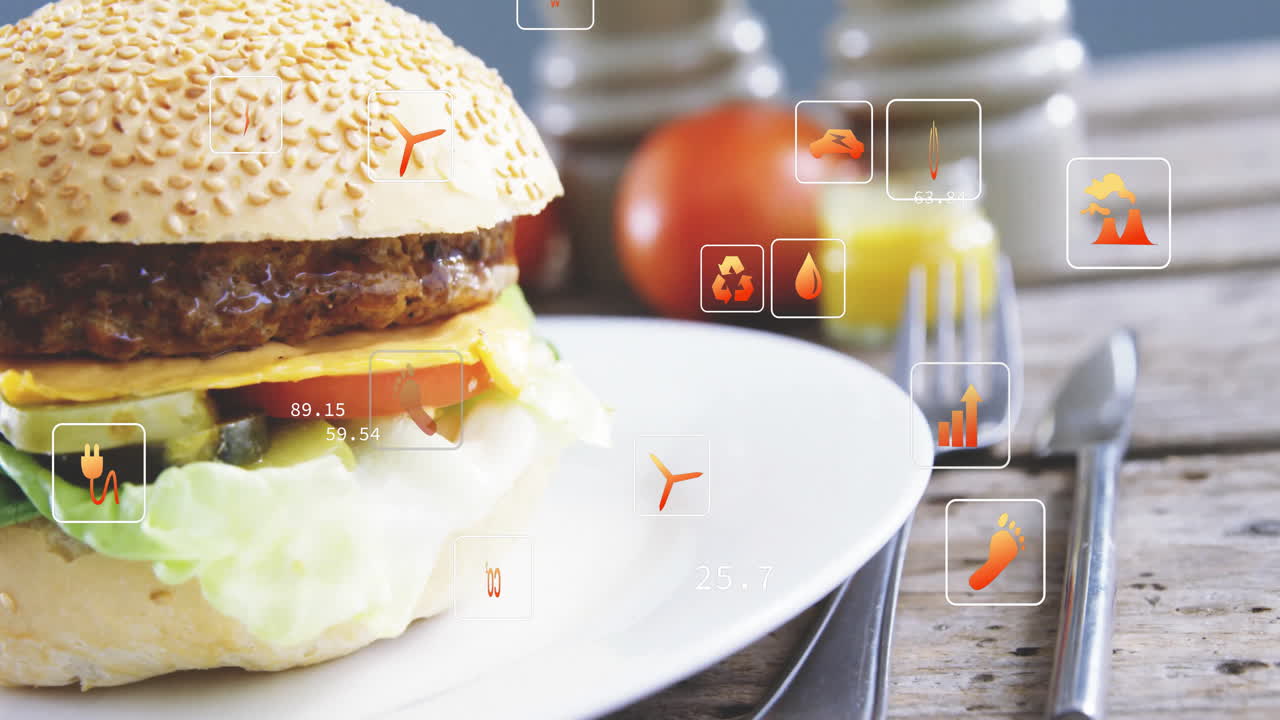 Burger with nutritional data and animation icons overlaying plate in kitchen